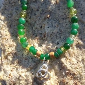 Celtic knot pendant with emerald and wood beads